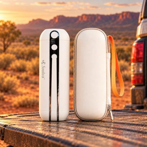 Soulea portable rechargeable electric bidet and carry case side by side on a ute tailgate at sunset, Australian outback